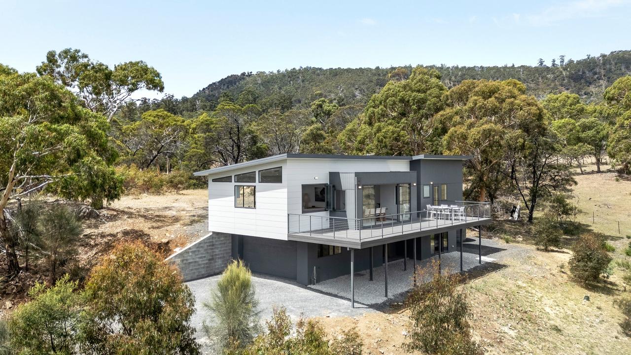 Bushland privacy and big views make admired home sing