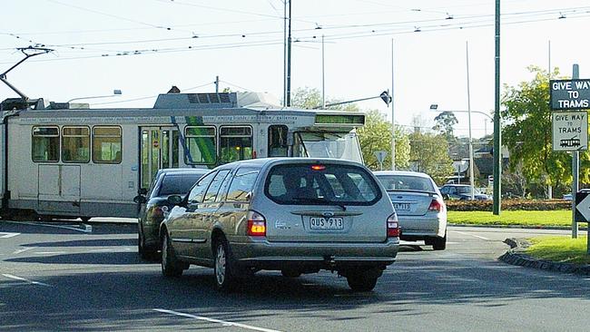 Traders want safety boosted at this chaotic Essendon roundabout, which is used by pedestrians, motorists and trams. Picture: Emily Black.