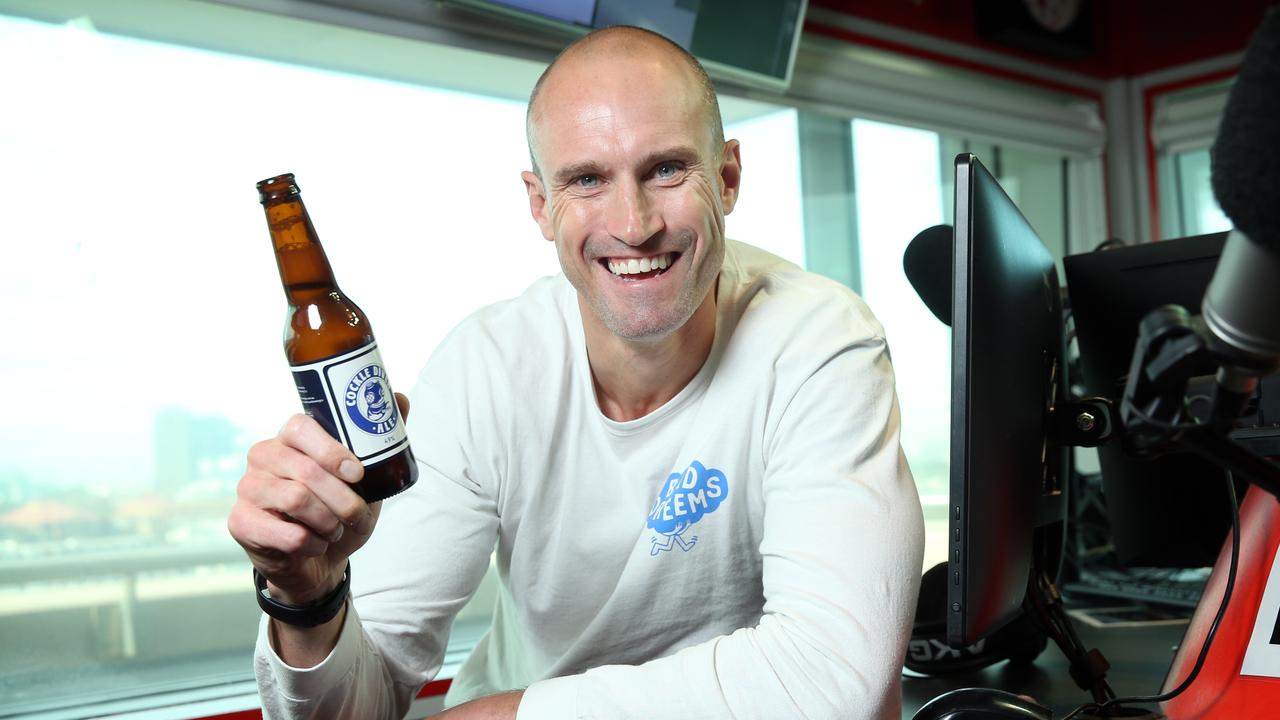 Pictured in Sydney is Ryan "Fitzy" Fitzgerald with a Cocklediver Ale beer - named after Fitzy's junior footy club Port Noarlunga Cockledivers.Picture: Richard Dobson