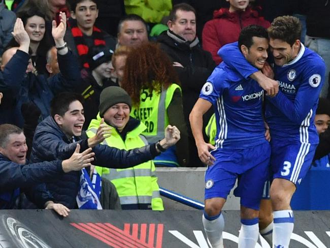 Chelsea's Spanish midfielder Pedro (L) celebrates scoring the opening goal