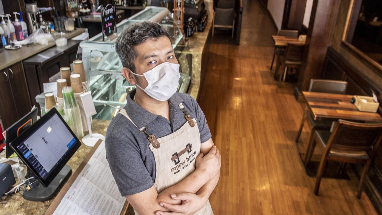 Tenzin Norbu from the Copper Bench is finding business slow in Ruthven St. Friday, January 14, 2022. Picture: Nev Madsen.