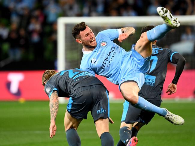 Luke Brattan (left) tackles Melbourne City’s Aiden O'Neill in last season’s A-League grand final. Picture: William West / AFP