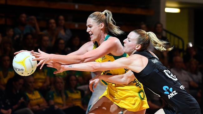 Australia’s Caitlin Bassett contests the ball with NZ’s Jane Watson in Townsville