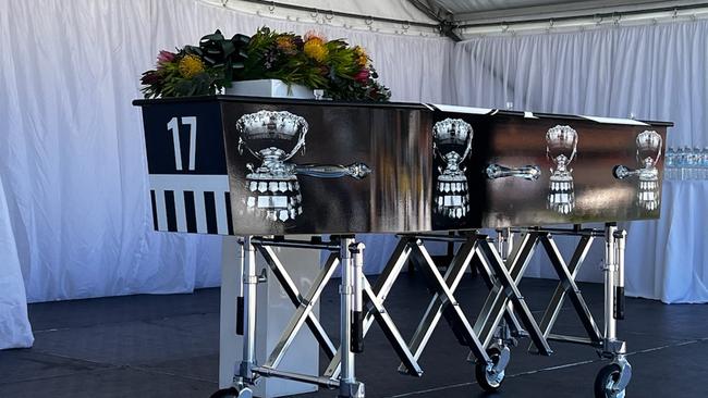 Port colours adorn the coffin of Port Adelaide great Geof Motley at Alberton Oval. Picture: Emma Brasier