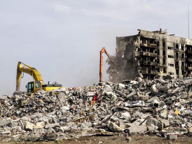 An excavator demolishes ruined buildings in Mariupol amid the ongoing Russian military action in Ukraine. Picture: AFP