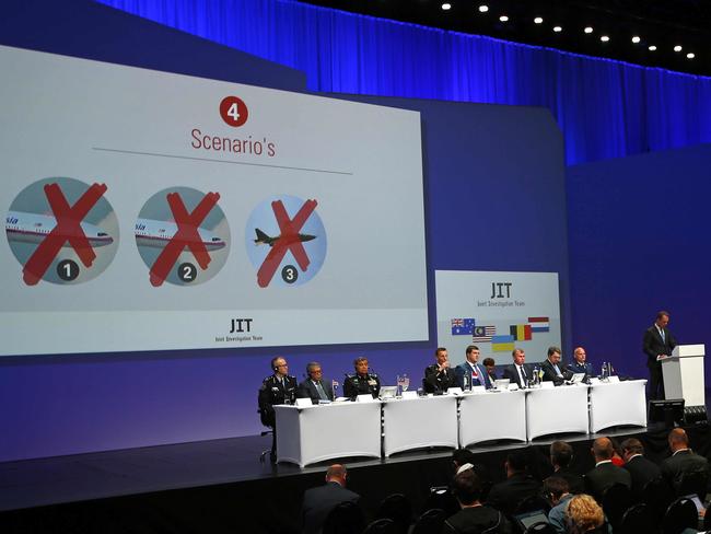 Fred Westerbeke of the Joint Investigation Team (JIT) speaks as possible scenarios into the downing of MH17 are put on display during a press conference on the preliminary results of the investigation. Picture: AP/Peter Dejong