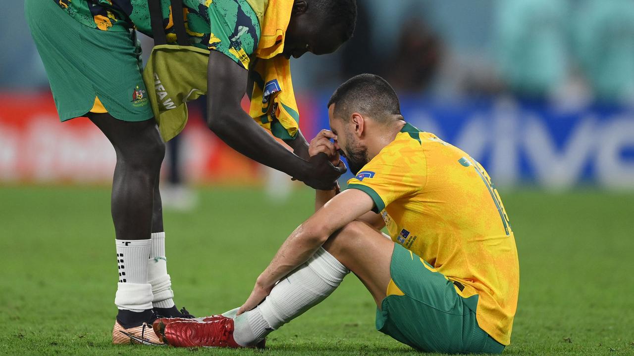 Aziz Behich was shattered after the final whistle. (Photo by FRANCK FIFE / AFP)