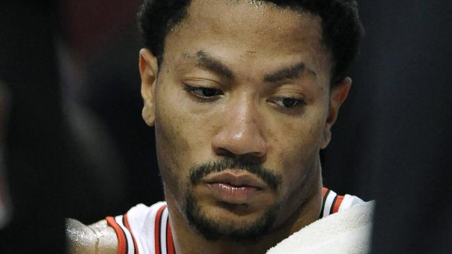 Chicago Bulls' Derrick Rose sits on the bench during the second half of an NBA basketball game against the Cleveland Cavaliers in Chicago, Friday, Oct. 31, 2014. Cleveland won 114-108 in overtime. (AP Photo/Paul Beaty)