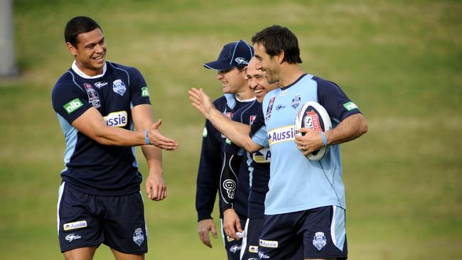 Timana Tahu (L) high-fives Andrew Johns (R) during a NSW State of Origin team training session at WIN Stadium, Wollongong.