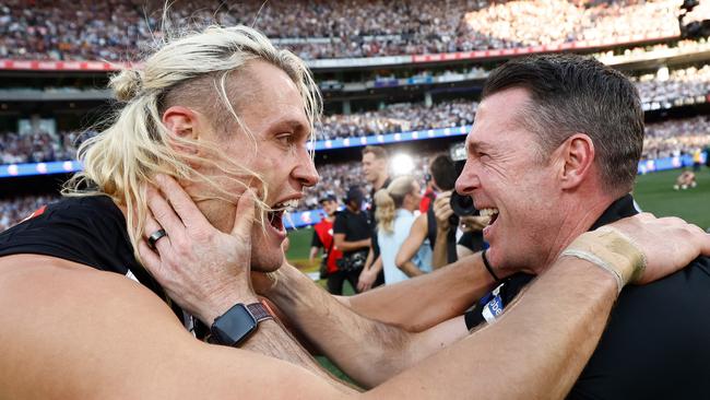 MELBOURNE, AUSTRALIA - SEPTEMBER 30: Darcy Moore of the Magpies and Craig McRae, Senior Coach of the Magpies celebrate during the 2023 AFL Grand Final match between the Collingwood Magpies and the Brisbane Lions at the Melbourne Cricket Ground on September 30, 2023 in Melbourne, Australia. (Photo by Michael Willson/AFL Photos via Getty Images)