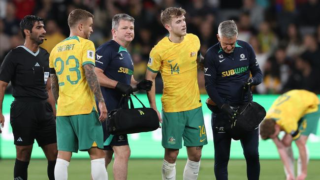 Socceroos star Riley McGree (14) leaves the field after injuring his foot in Australia’s 2-0 win over Lebanon at CommBank Stadium last month. Picture: Matt King/Getty Images