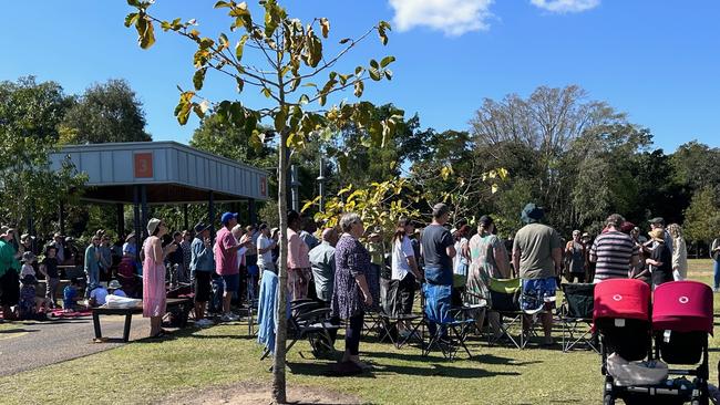 Members of the Oasis Church gathered at Kershaw Gardens, Rockhampton, after a fire destroyed their church.