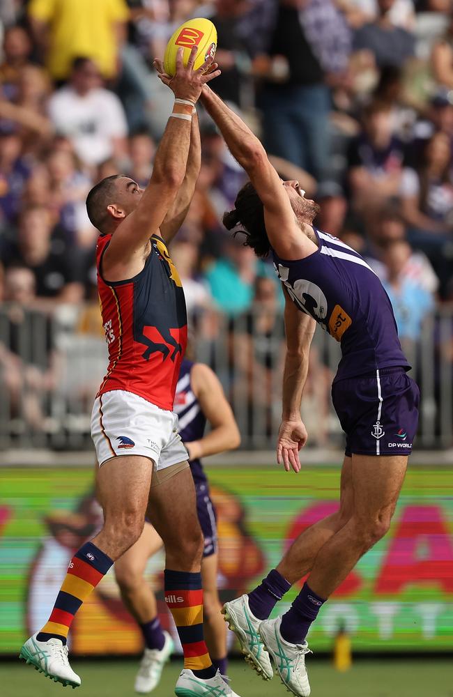 Taylor Walker and Alex Pearce compete on Friday night. Picture: Paul Kane/Getty Images