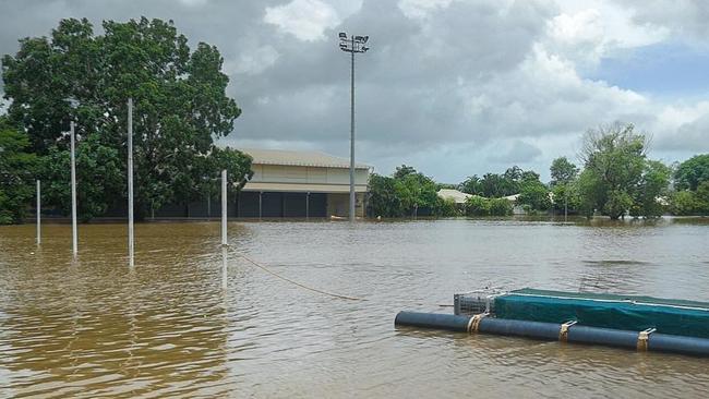 The Daly River footy oval goalposts are being used as an anchor for a floating croc trap, which is designed to collect the critters roaming through the flooded community. Picture: NTPFES