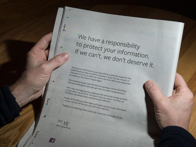 A man reads a full-page advertisement, taken out by Mark Zuckerberg, the chairman and chief executive officer of Facebook to apologise for the large-scale leak of personal data from the social network, on the backpage of a newspaper, in Ripon, England. Picture: AFP