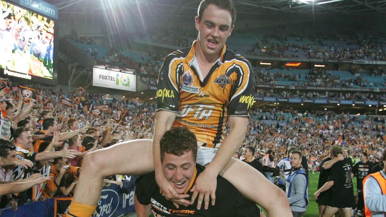 Liam Fulton and Bryce Gibbs celebrate the Tigers 2005 premiership win.