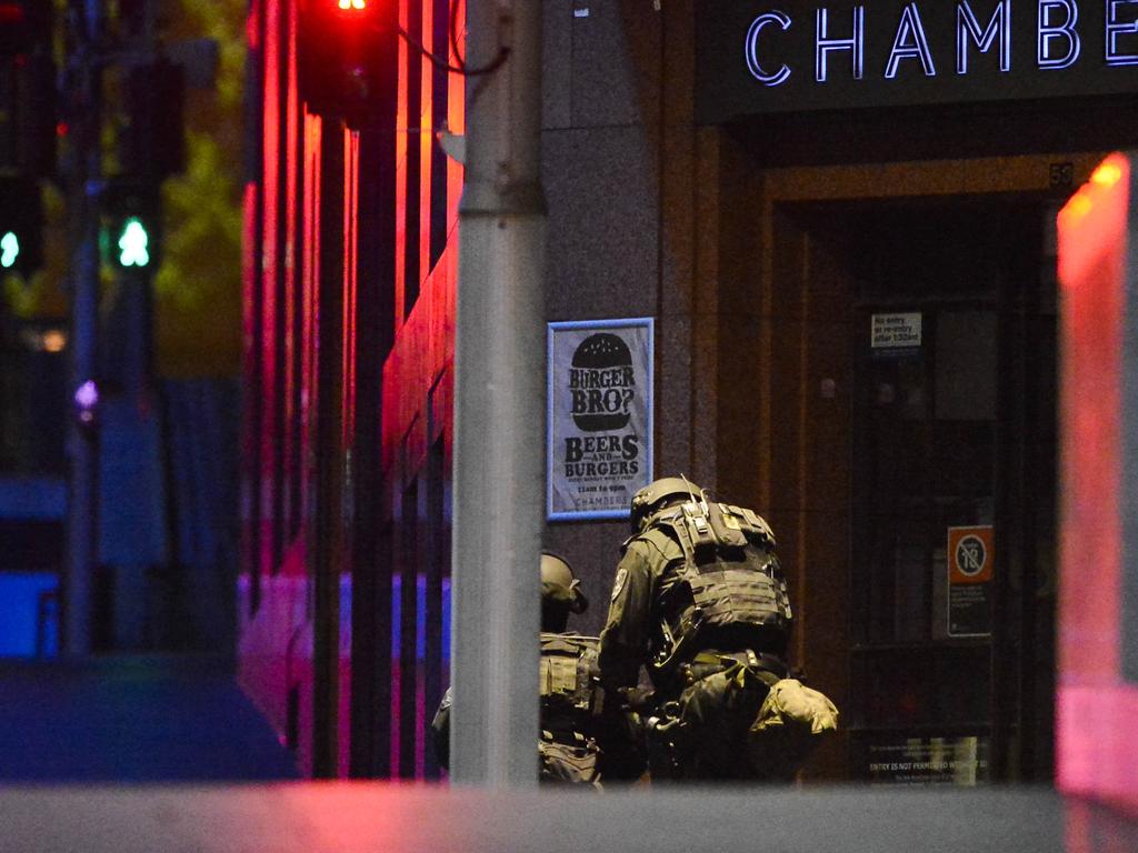 Police attend a siege in the Lindt shop in Sydney's Martin Place. Photos: Chris McKeen