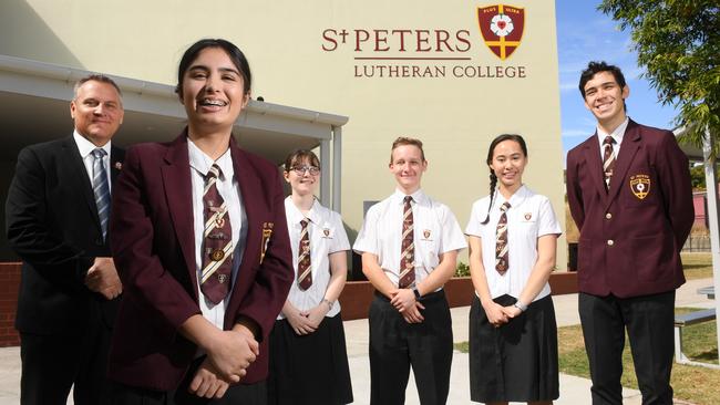 St Peters Lutheran College principal Craig Schmidt with students Ahushi Purswani, Grace Lashbrook, Zac Hyde, Minna Hood and Nathan Jacobs. The school moves from third to second on the list with a 26 per cent income increase over the five-year period totalling $284m.