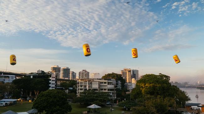 Four giant inflatable XXXX beer cans have been flown over the river city in support of the maroons ahead of the State of Origin opener.