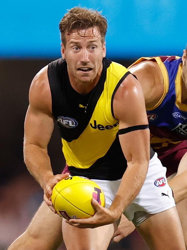 Kane Lambert plays a key role releasing teammate Dustin Martin.