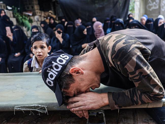 A friend of 25-year-old Palestinian Yousef Radwan, who was killed the previous day amid clashes following anti-Israel protests by the Gaza Strip's eastern border fence, cries during his funeral. Picture: Said Khatib/AFP