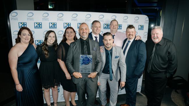 VenuesLive staff celebrate their win.