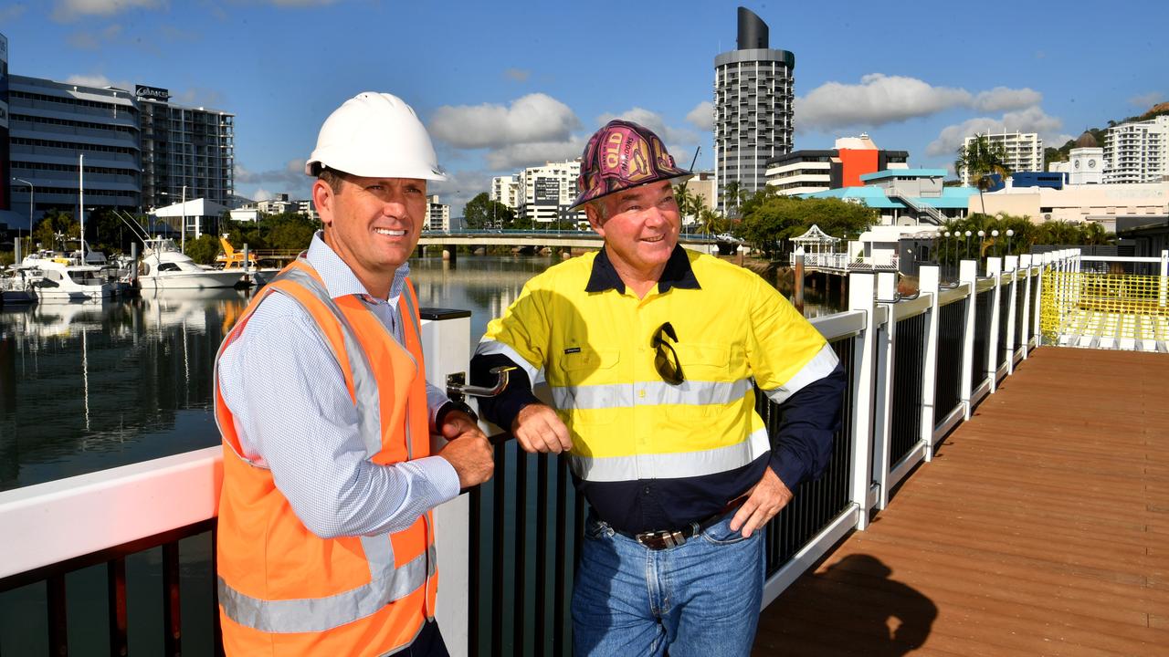Cr Mark Molachino and Townsville MP Scott Stewart at the East End Boardwalk, which won’t connect to the George Roberts Bridge behind them. Picture: Evan Morgan