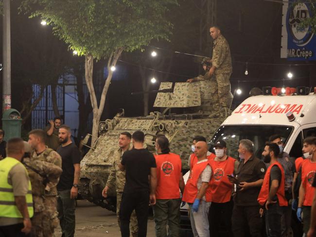 Emergency responders gather at the site of an Israeli strike on Beirut's southern suburbs. Picture: AFP