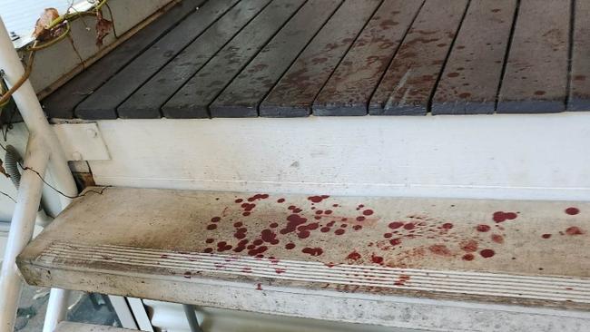 Blood on the stairs after a break-in at Char.