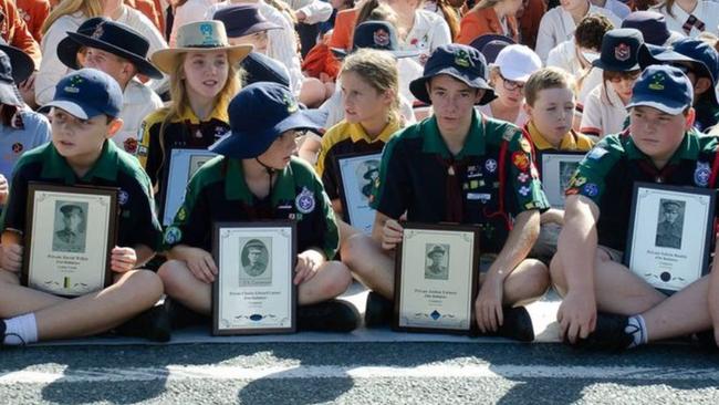 Young children attend the Upper Coomera war memorial for the 2024 Anzac Day ceremony.