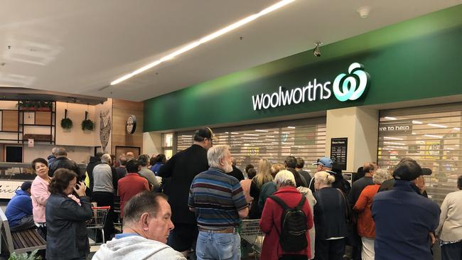 Shoppers brave the first morning of Woolworths Blacktown's dedicated shopping hour for the elderly and disabled in the face of the coronavirus outbreak.