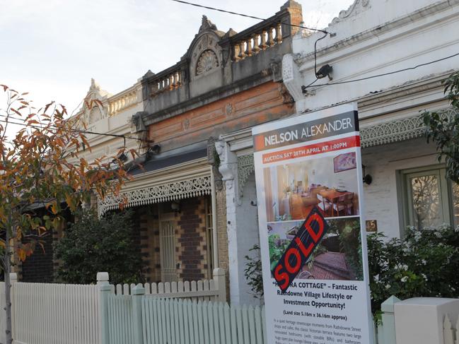 A 'sold' sign in front of a terrace home for sale in the inner-northern suburb of Brunswick in Melbourne, Monday, May 6, 2013. (AAP Image/David Crosling) NO ARCHIVING