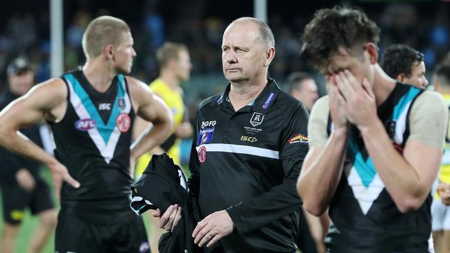 Port Adelaide coach Ken Hinkley consoles his players after the loss. Picture: Sarah Reed