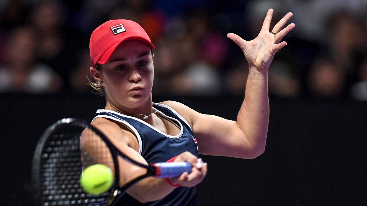 Barty hits a return against Elina Svitolina. (Photo by NOEL CELIS / AFP)