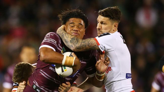 Gareth Widdop of the Dragons tackles Sea Eagle Moses Suli. Picture; Mark Nolan/Getty Images.