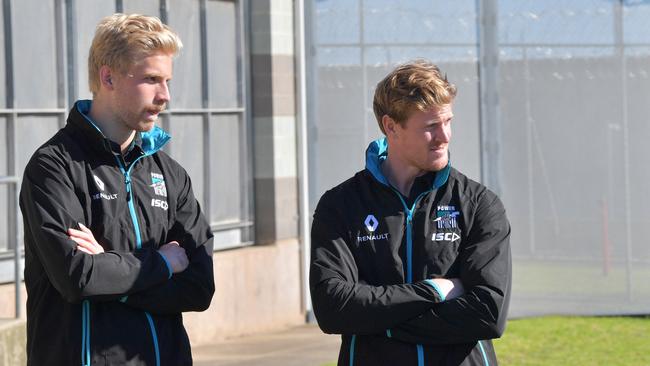 Port Adelaide’s Billy Frampton and Tom Jonas at Yatala Prison yesterday.