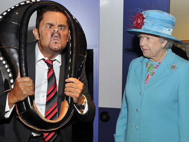 The Queen meets watches Tommy Mattinson the world gurning champion during her visit to the Beacon Museum in Whitehaven Cumbria. Picture: Arthur Edwards.