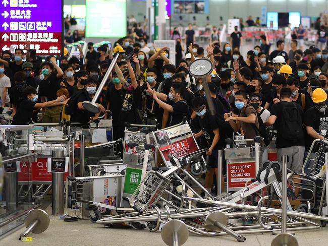 Pro-democracy protesters block the entrance to the airport terminals after a scuffle with police at Hong Kong's international airport. Picture: AFP