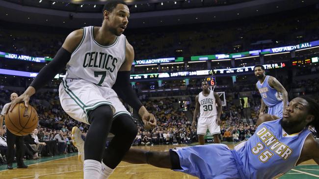 Denver Nuggets forward Kenneth Faried (35) falls to the floor after fouling Boston Celtics forward Jared Sullinger (7).