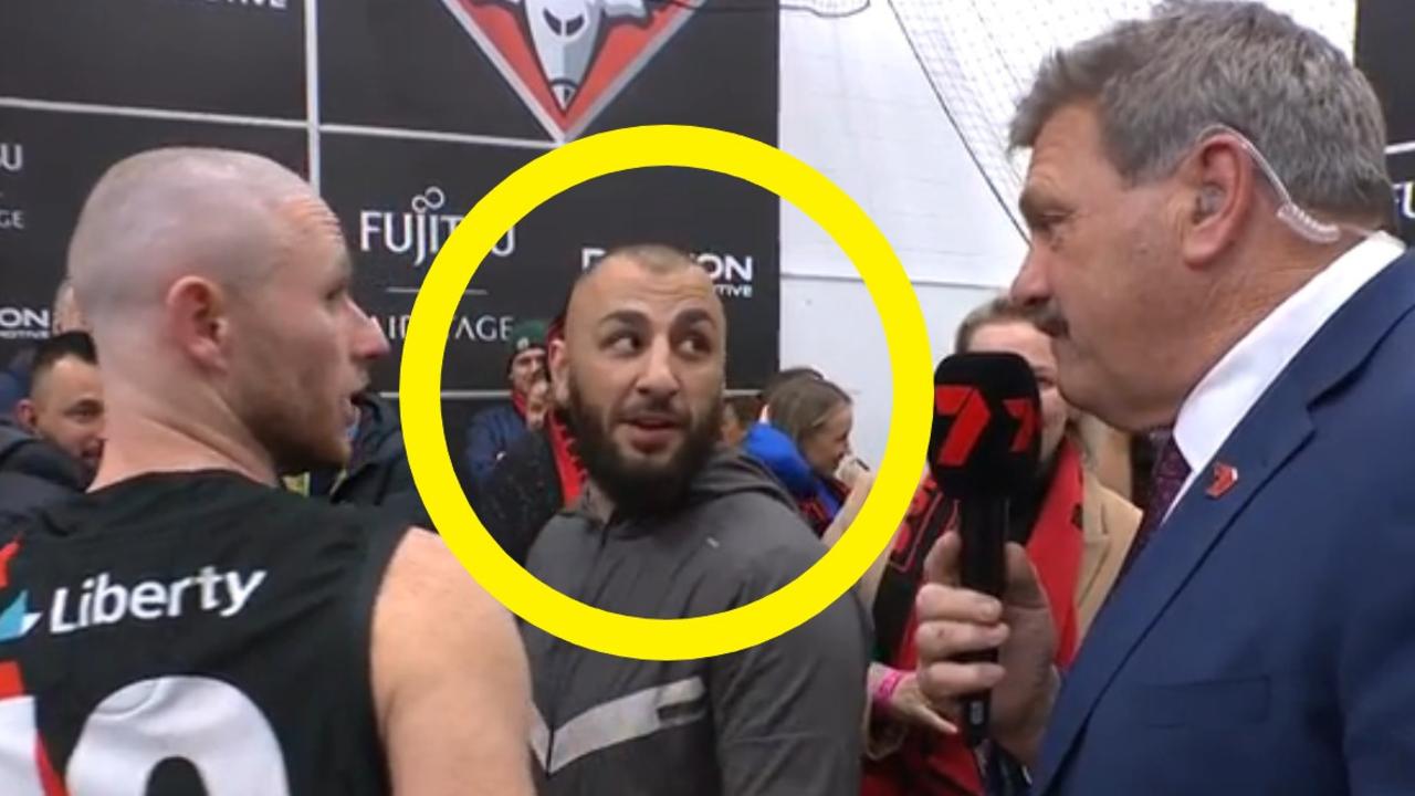 AFL alerted after convicted killer spotted in Essendon change rooms