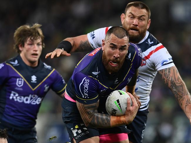 MELBOURNE, AUSTRALIA - AUGUST 26:  Nelson Asofa-Solomona of the Storm is tackled by Luke Keary of the Roosters during the round 24 NRL match between the Melbourne Storm and the Sydney Roosters at AAMI Park on August 26, 2022, in Melbourne, Australia. (Photo by Quinn Rooney/Getty Images)