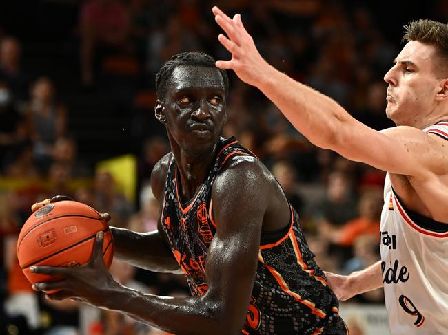 CAIRNS, AUSTRALIA - JANUARY 13: Akoldah Gak  of the Taipans catches the rebound during the round 15 NBL match between Cairns Taipans and Adelaide 36ers at Cairns Convention Centre, on January 13, 2024, in Cairns, Australia. (Photo by Emily Barker/Getty Images)