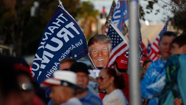 Supporters of former President Donald Trump gather near his residence at the Mar-a-Lago Club on April 4, 2023 in West Palm Beach, Florida.