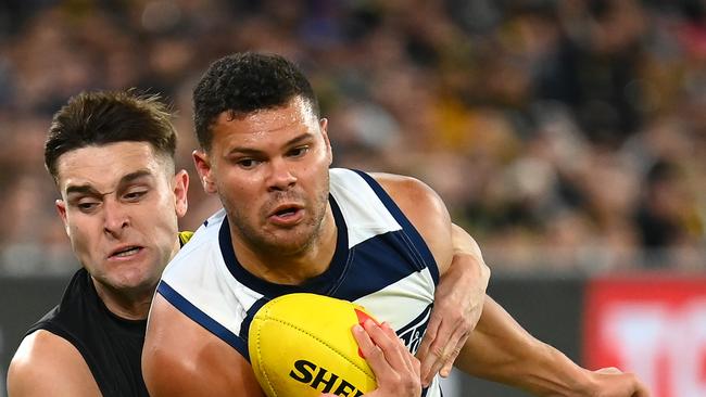 MELBOURNE, AUSTRALIA - MAY 12: Brandan Parfitt of the Cats is tackled by Jayden Short of the Tigers during the round nine AFL match between Richmond Tigers and Geelong Cats at Melbourne Cricket Ground, on May 12, 2023, in Melbourne, Australia. (Photo by Quinn Rooney/Getty Images)