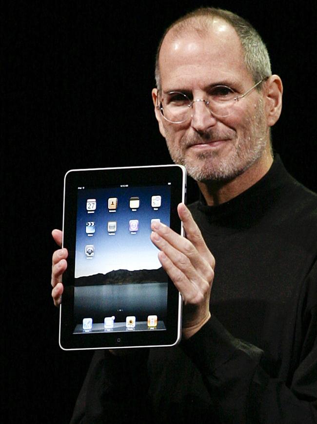 Steve Jobs with the original iPad.