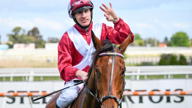 Pike returns to the mounting yard after winning the Caulfield Stakes.