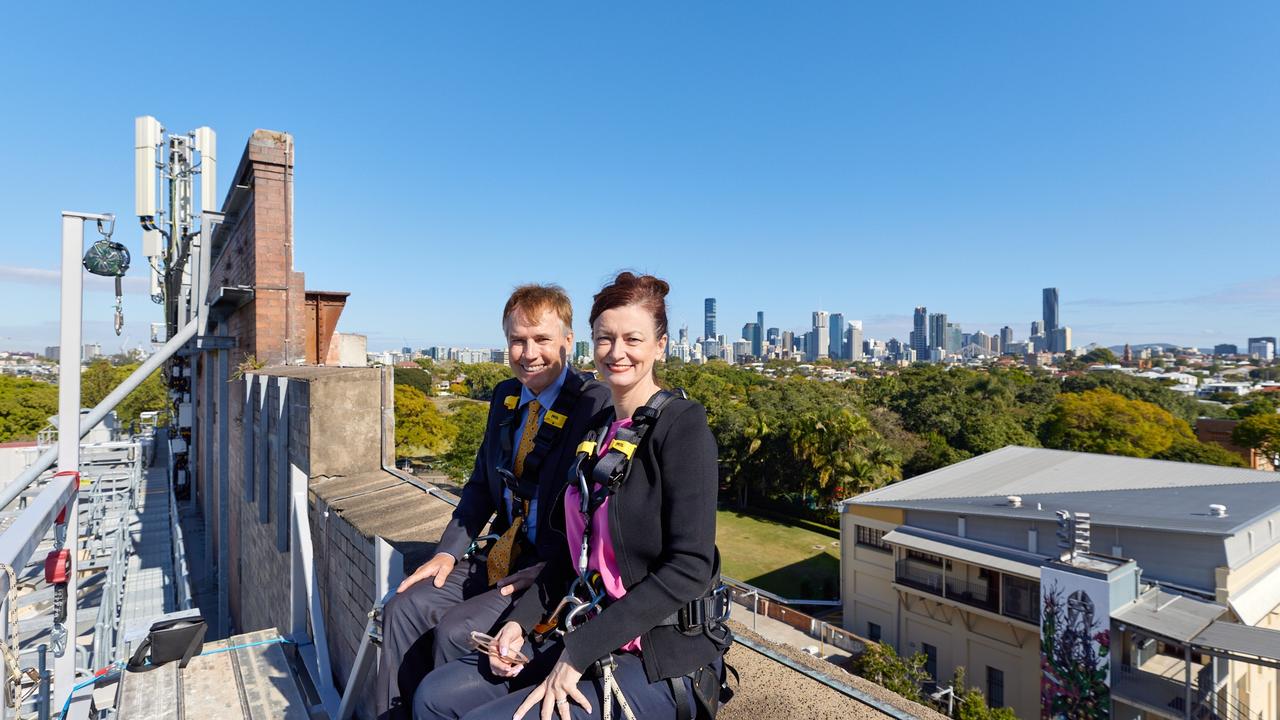 John Sharpe and Kate Gould on the edge of the Brisbane Powerhouse roof in New Farm.