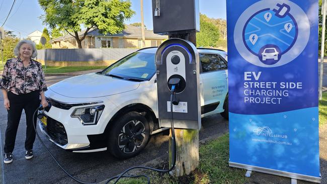 Northern Beaches mayor Sue Heins at one of seven new charging stations installed on power poles as part of an Australian-first trial, which began in May last year, turning street side poles into charging stations for electric vehicles. Picture: Supplied