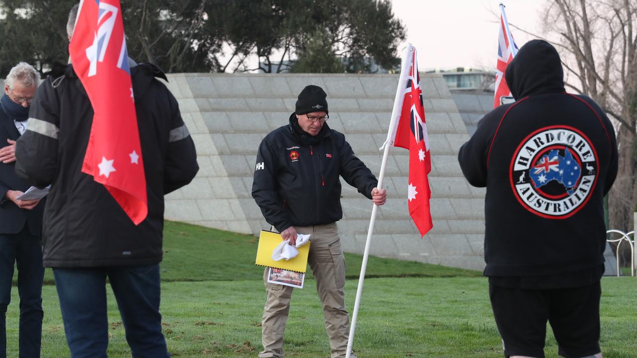 A protester holds a flag at the Shrine of Remembrance. Picture: David Crosling / NCA NewsWire