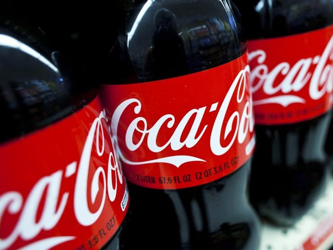 26/07/2011 BUSINESS: Bottles of Coca-Cola Co. soft drinks are displayed on the shelf at a supermarket in the Brooklyn borough of New York, U.S., on Tuesday, July 26, 2011. Coca-Cola said last week it will raise North American drink prices 3 percent to 4 percent in the second half of 2011. Photographer: Ramin Talaie/Bloomberg